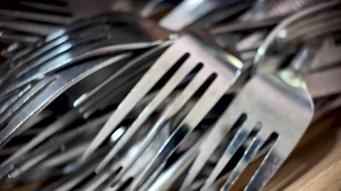 Stacked Metal Forks in Close-Up Capturing Dining and Organizational Concepts Stock Footage 314049045