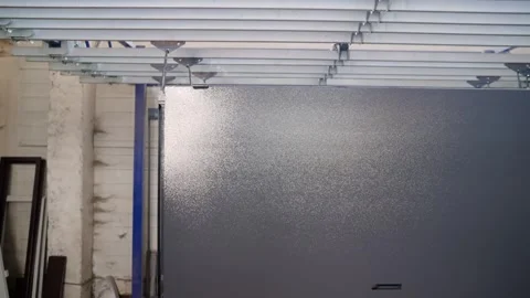 Stacked metal window frames with glass panes in workshop Stock Footage 304704546