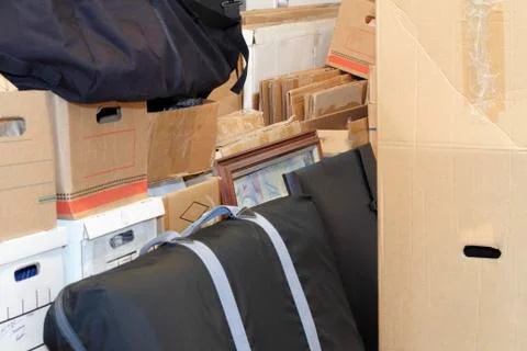 Stacked moving boxes and cases Stock Photos