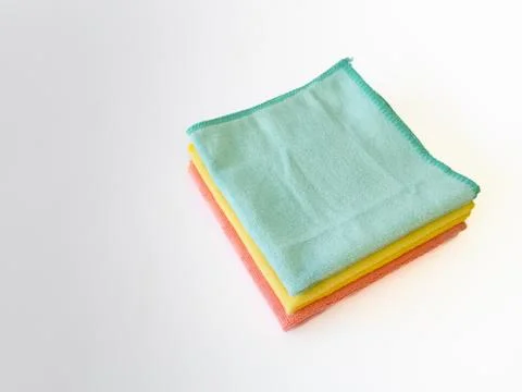 Stacked Multicolor Microfiber Cloths on White Background with Negative Spac.. Stock Photos
