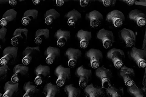 Stacked of old bottles in the cellar Fotos de archivo