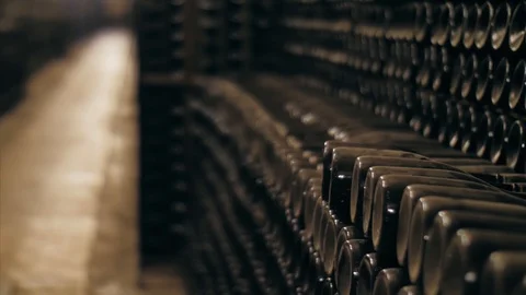 Stacked of old wine bottles in the cellar Stock Footage 127181484