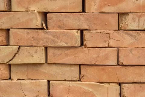 Stacked orange solid clay brick background 스톡 사진