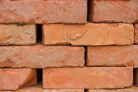 Stacked orange solid clay brick background Stock Photos