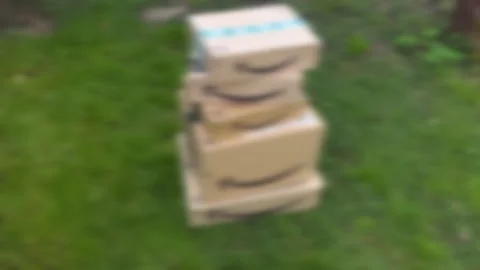 Stacked Parcels on Green Grass 스톡 동영상 263266688
