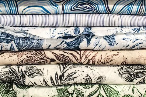 Stacked patterned fabric textile background Foto stock