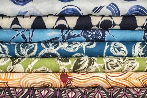 Stacked patterned fabric textile background Foto stock