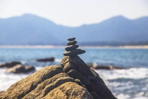 Stacked pebbles on the beach Fotos de archivo