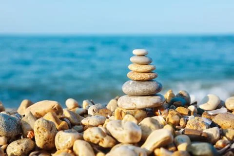 Stacked pebbles on the sea side Stock-Fotos