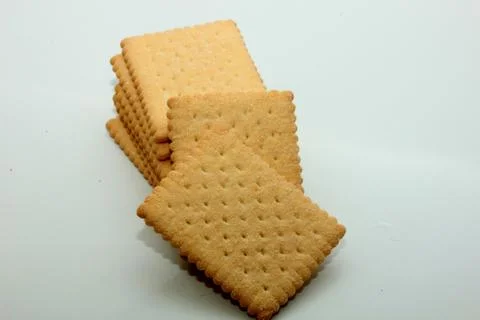 Stacked plain bisuits on a white background Stock Photos