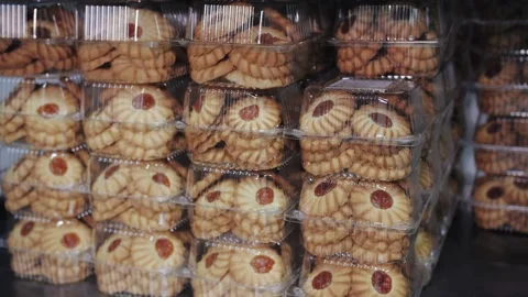 Stacked Plastic Containers of Jam Thumbprint Cookies, Close-Up Video stock 321808800