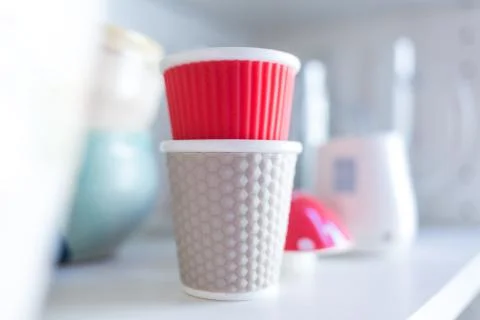 Stacked Plastic Cups on Shelf Stock Photos