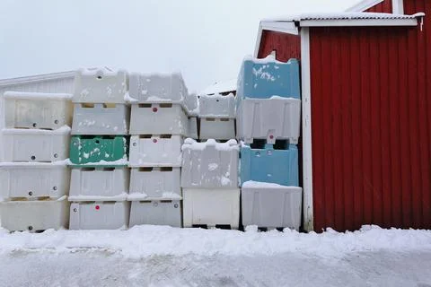 Stacked plastic pallet boxes for fish storage-port warehouse. Hamnoy-Lofoten-NO Stock Photos