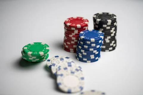 Stacked poker chips with one stack fallen Stock Photos