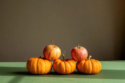 Stacked pumpkins and apples Stock Photos
