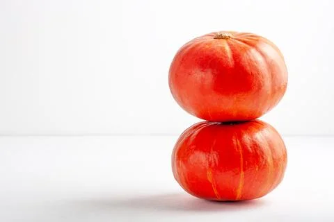 Stacked pumpkins on a white background. Stock Photos