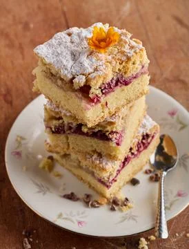 Stacked Raspberry Crumb Cake Dusted With Powdered Sugar Stock Photos