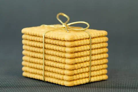 Stacked rectangular Cookies tied with a golden christmas ribbon. Christmas... Stockfoto's