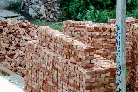 Stacked Red Bricks at Construction Site 写真素材