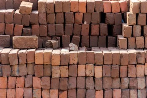 Stacked red bricks ready to use for construction Stock Photos
