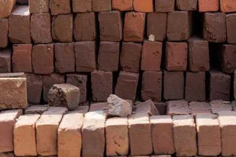 Stacked red bricks ready to use for construction Stacked red bricks ready ... Stock Photos
