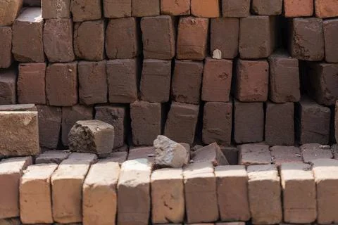Stacked red bricks ready to use for construction Stockfoto's