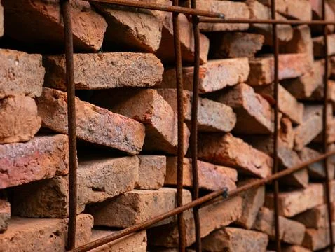 Stacked Red Clay Bricks in Construction Site - Traditional Building Materia.. Stock Photos