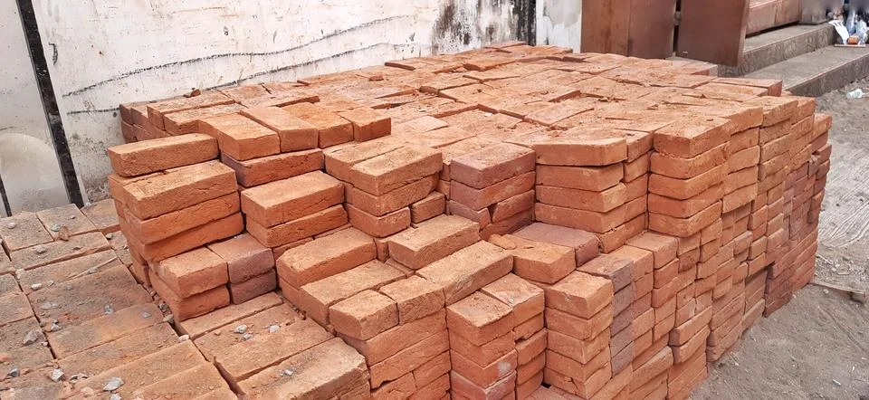 Stacked Red Clay Bricks for Construction Site Stock Photos