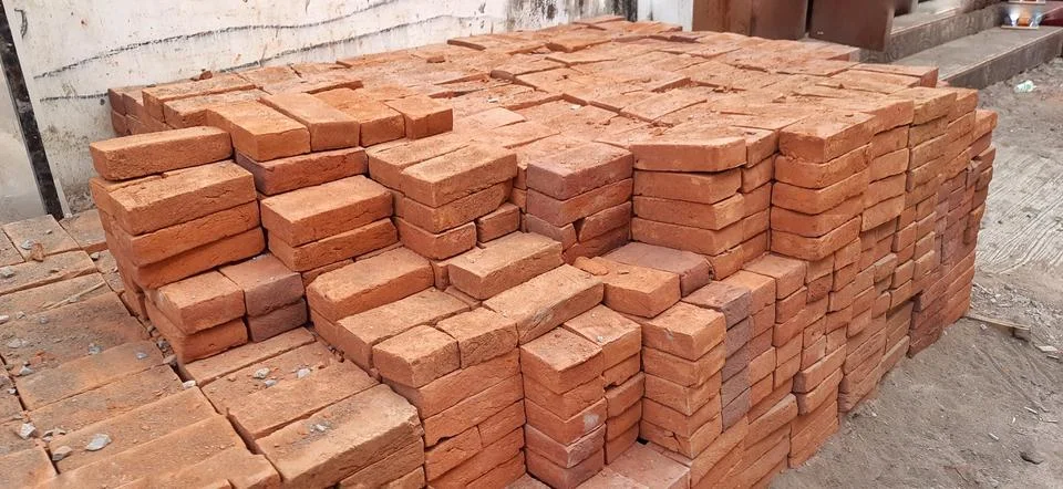 Stacked Red Clay Bricks for Construction Site Stock Photos