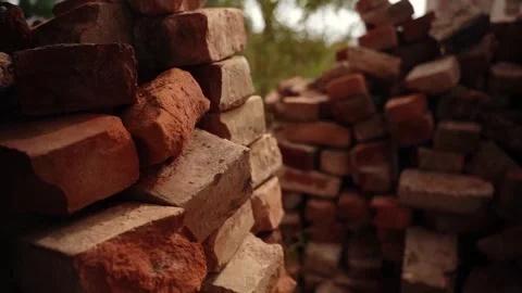 Stacked red clay bricks in outdoor yard Video stock 347535792