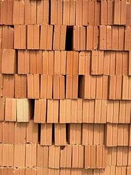 Stacked red clay bricks Foto stock