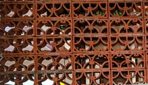 Stacked Red Clay Ventilation Blocks with Decorative Patterns Stock Photos