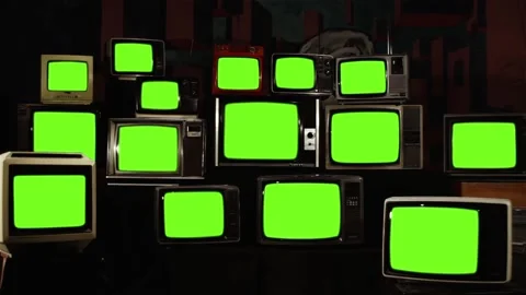 Stacked Retro Vintage TVs Turning On Green Screens. Stock Footage