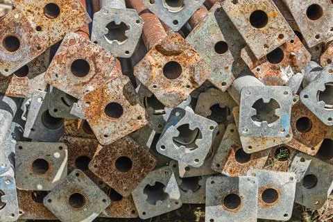 Stacked Rusted Scaffolding Base Plates Close-Up Showing Corrosion, Texture .. Stock Photos