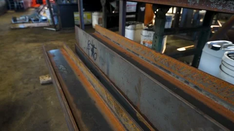 Stacked Rusted Structural Steel Beams Inside Industrial Fabrication Workshop Stock Footage 330805635
