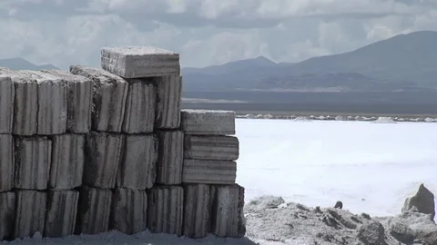Stacked Salt Blocks in Open Salt Flat, With Andean Mountains, Salinas Grandes  스톡 동영상 148736355