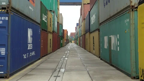 Stacked Shipping Containers in Dock 4K Stock Footage 126983859
