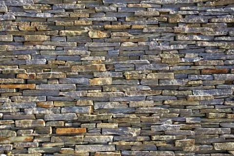Stacked slate bricks wall texture Stock Photos