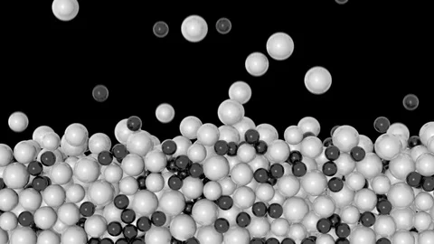 Stacked spheres background - falling small white and black pearls (FULL HD) Stock Footage 75934641