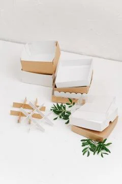 Stacked square box bases, with alternating white and brown cardboard. High an Stock Photos