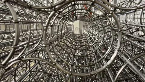 Stacked Stainless Wire Baskets Forming Tunnel Pattern Stock Footage 333310343