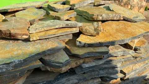 Stacked stone slabs for construction projects with natural textures and sun.. Stock Footage 324811036