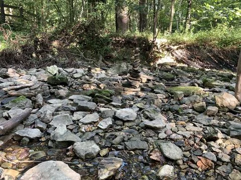 Stacked stone surrounded by rocks Stock Photos