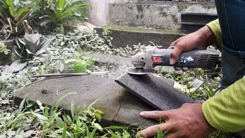 Stacked stone tiles and angle grinder Stock Footage 324324116