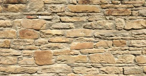 Stacked stone wall background horizontal. White stone tile texture brick wall Stock-Fotos