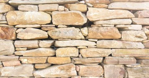 Stacked stone wall background horizontal. White stone tile texture brick wall Stock Photos