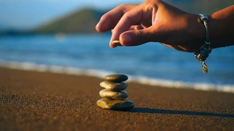 Stacked stones at the beach close up Stock Footage 97906295