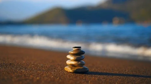 Stacked stones at the beach close up Stock Footage 97906386