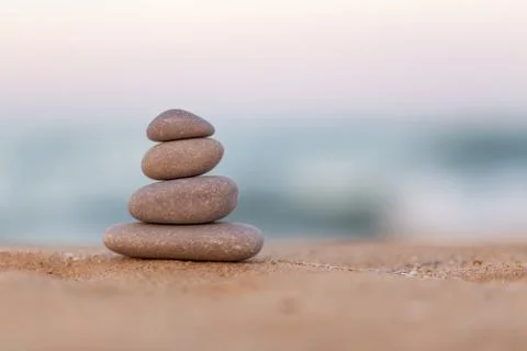 Stacked stones on the beach Foto stock