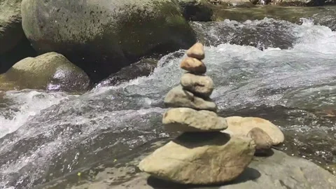 Stacked Stones by Mountain Stream Stock Footage 322208962